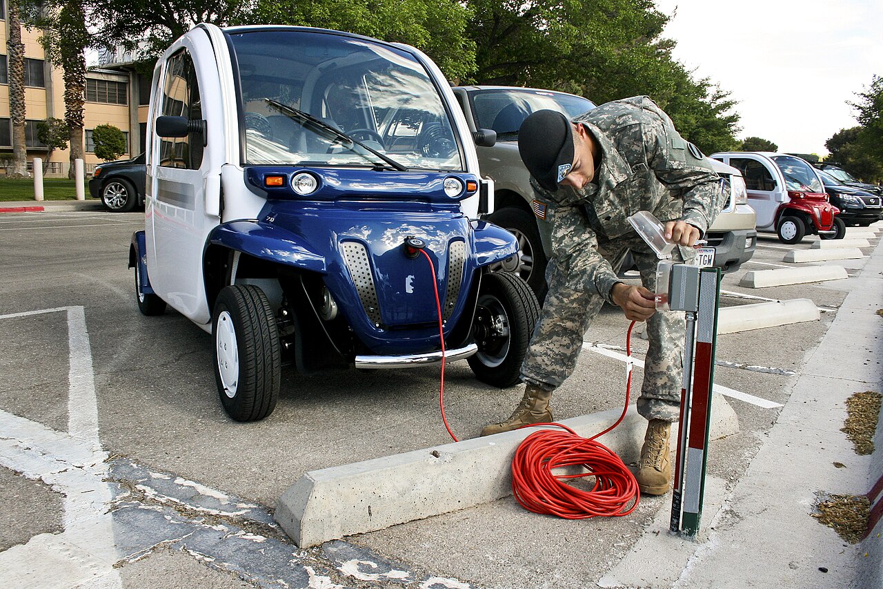 U.S. Army Spc. Dean Kalogris charges the installation's command sergeant major's electric car on Fort Bliss, Texas, April 14, 2010.The base leaders dr