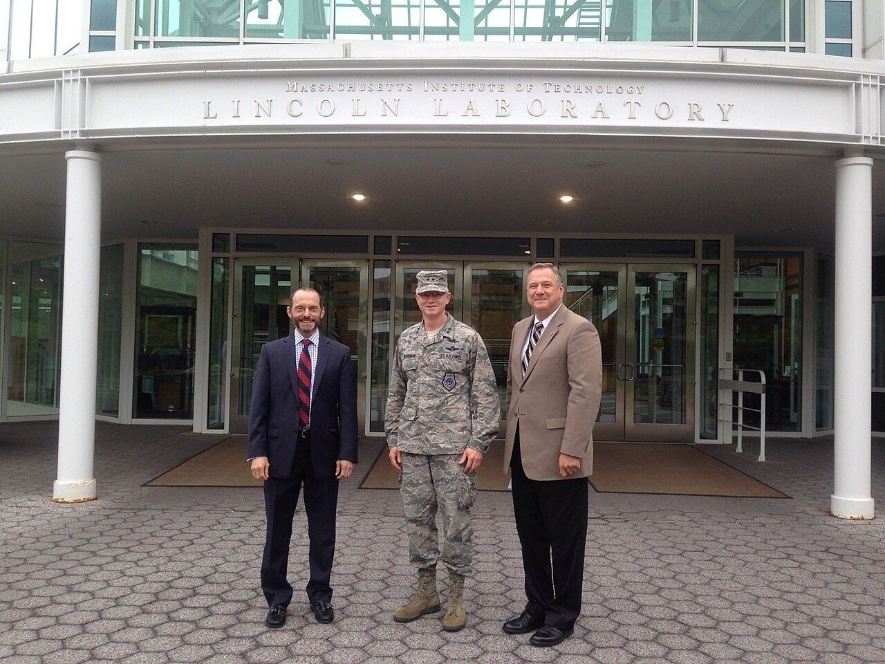 Maj. Gen. Christopher Weggeman, 24th Air Force commander, poses with Mr. Chris Putko (right), Executive Officer, Cyber Security and Communication Syst