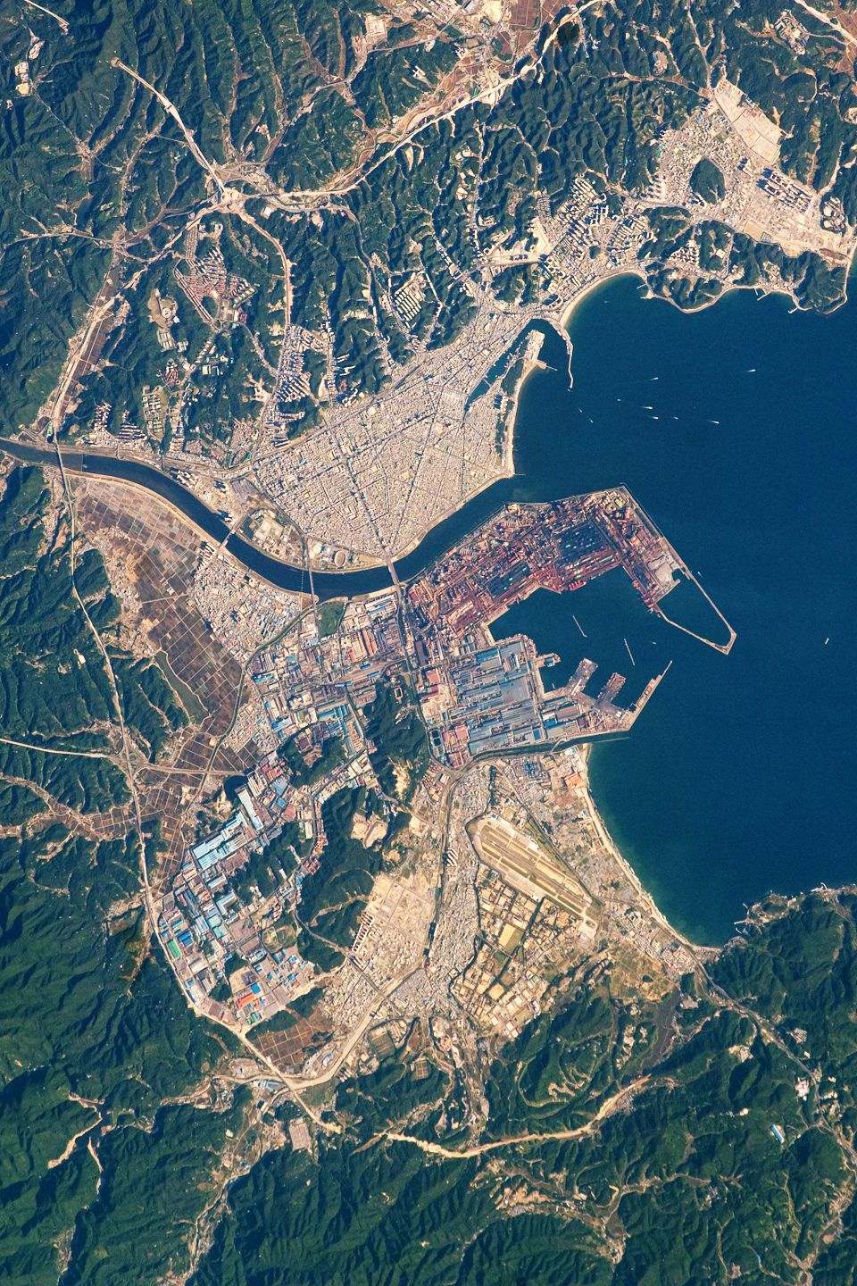 The port city of Pohang is located on the eastern coastline of South Korea and provides access to the East Sea and Sea of Japan. In this astronaut pho
